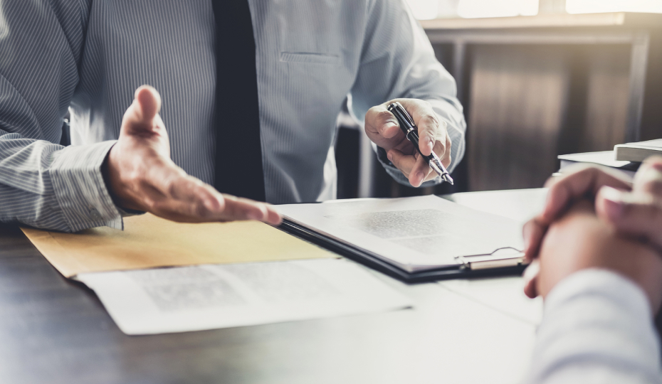 Man Explaining Documents to Person